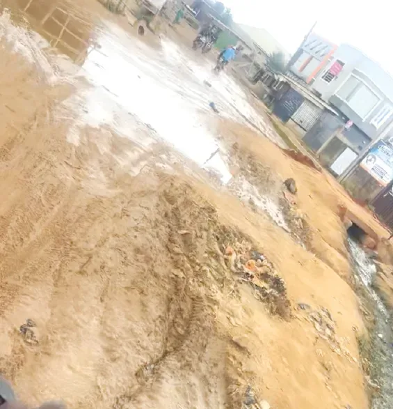 Waterlogged and muddy section of the community road in Oke Sefu, Ibafo, Ogun State