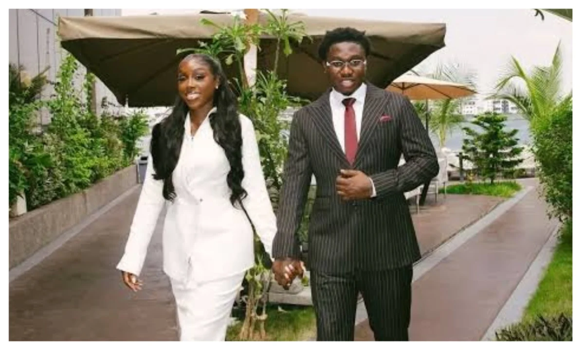 Zlatan and Davita Lamai walking outdoors while holding hands