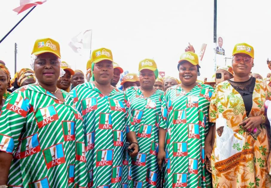 Women wearing APC-branded clothing and caps during a political rally in Ilorin
