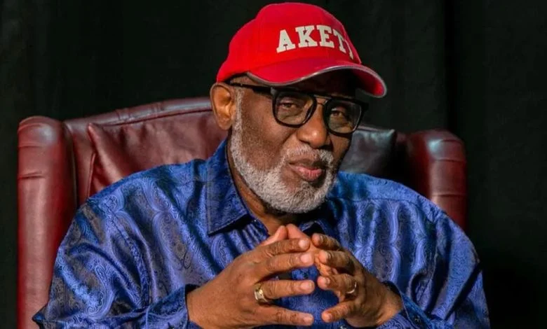 Late Ondo State Governor Rotimi Akeredolu seated and wearing glasses and a red cap