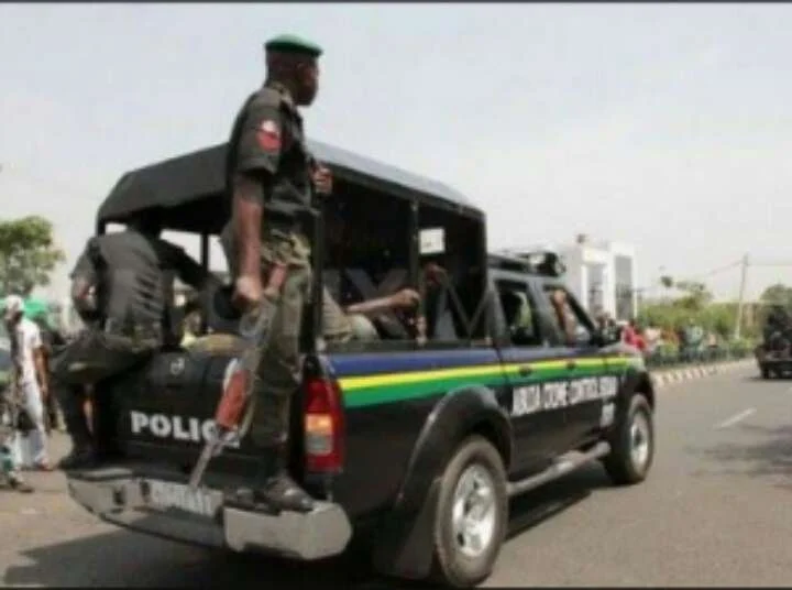 Nigeria Police officers travelling in a police pickup vehicle