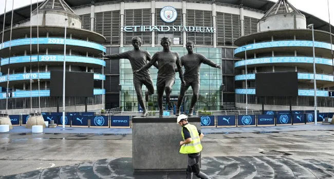 Statue of former Manchester City players Colin Bell, Francis Lee and Mike Summerbee outside the Etihad Stadium in Manchester