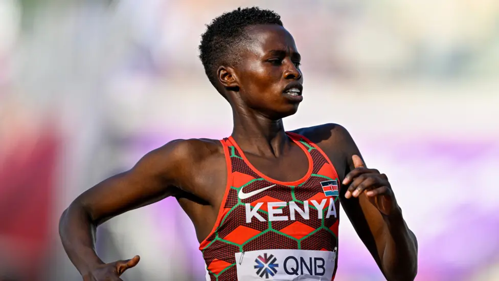 Kenyan runner Naomi Korir wearing a Kenya athletics vest during a race