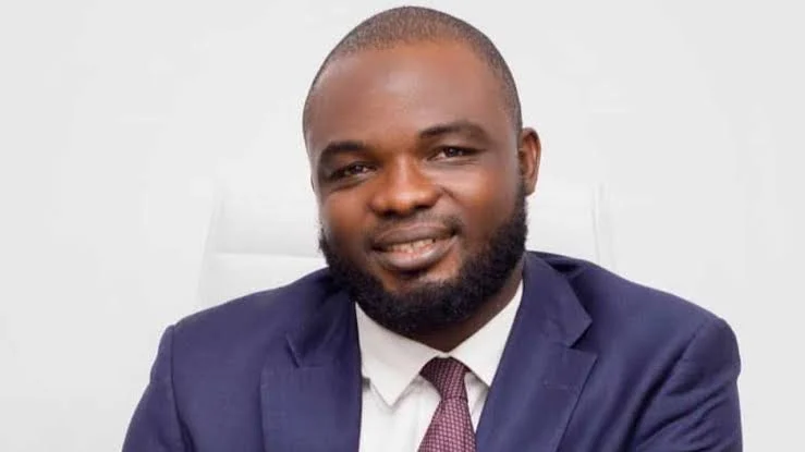 Portrait of Nigerian lawyer Yusuf Nurudeen wearing a dark suit and tie