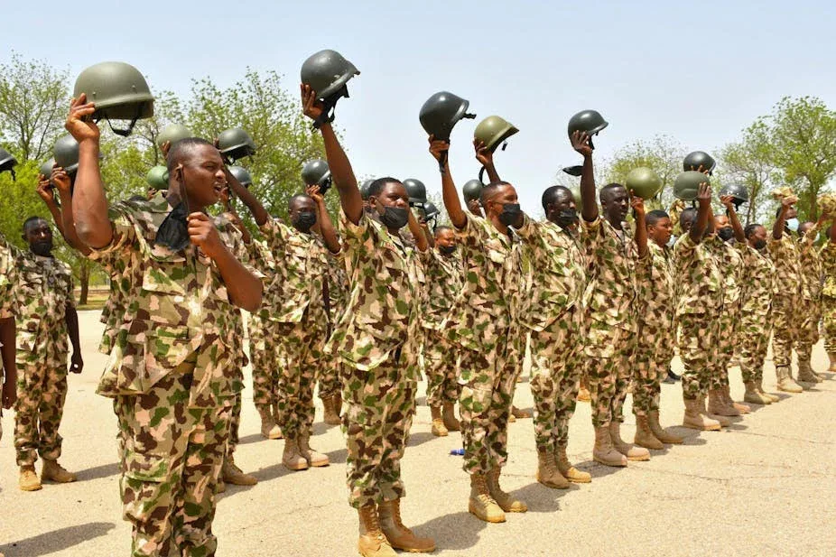 Nigerian Army personnel in camouflage uniforms standing together